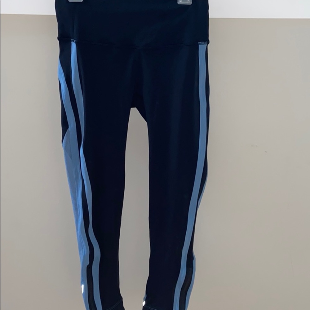 black lululemon cropped pants with blue stripes